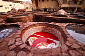 Vibrant red dye in a traditional leather tannery pit, Fes, UNESCO, Morocco
