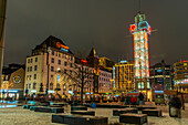 View of buildings and city tram in Jernbanetorget during winter at dusk, Oslo, Norway, Scandinavia
