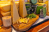 View of local cheeses on Christmas market stall, Stortingsparken, Oslo, Norway, Scandinavia
