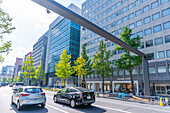 View of shops and traffic on busy shopping street, Osaka, Honshu, Japan