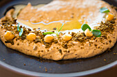 Dish of Olive Hummus served at Harrat restaurant of Banyan Tree AlUla, Medina Province, Saudi Arabia