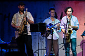Seville, Spain, July 26 2022, Musicians Enrique Oliver and Danil Torres play saxophones passionately during a live jazz concert at CAAC in Seville, Spain, creating an electrifying atmosphere.