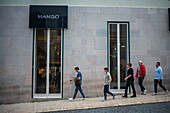People walking by Mango store in Chiado, Lisbon