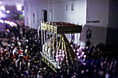 Seville, Spain, Apr 9 2009, Crowds gather as the paso de palio of Virgen del Mayor Dolor moves through Seville's streets, showcasing solemn beauty during Holy Week.