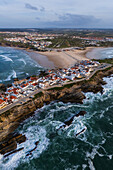 Aerial view of Vestigios do Forte, the rocky cliffs of Baleal Island and local architecture, Portugal
