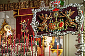 Holy Week celebrations in Seville showcase the Gitanos brotherhood banner, featuring Jesús de la Salud and the Virgin of the Angustias.