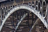The intricate metalwork of Triana bridge showcases Seville's beauty during Holy Week, reflecting the spirit of Andalusia.