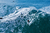 Aerial drone view of Big wave surfing in Praia do Norte (North Beach), listed on the Guinness World Records for the biggest waves ever surfed, formed under the influence of the Nazare Canyon, Portugal