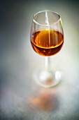 A glass of Amontillado wine captured with a wide-aperture vintage lens.