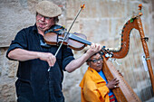 Salamanca, Spain, Aug 18 2018, Violinist and harpist perform live on the streets of Salamanca, Castilla y Leon.