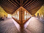 Codalet, France, Aug 22 2022, Visitors admire the stunning arches and stonework of the cloister in the ancient abbey of Saint-Michel de Cuxa, Codalet, France.