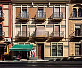Modernist house, designed by Jose Gomez Millan in 1913, showcases unique architectural features in Seville's Arenal neighborhood.