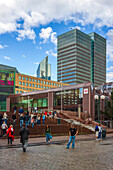 Oslo, Norway, Aug 10 2017, Visitors stroll around Oslo Central Station amidst contemporary buildings and a vibrant city atmosphere during a clear day.