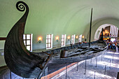 Oslo, Norway, Aug 10 2017, A well-preserved Viking ship exhibits its intricate design, drawing visitors at the Viking Ship Museum in Bygdoy, Oslo.