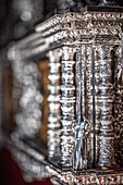 This silver nazareno, crafted by the Hermandad del Amor, shows intricate details at the paso de palio of the Virgen del Socorro.