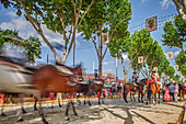 Seville, Spain, Apr 29 2009, Colorful carriages and riders create a lively atmosphere at April's Fair in Seville, capturing the spirit of Andalusia under a bright sky.