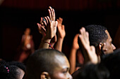 Spectators enjoying the artists' performances at the Pablo Tobón Uribe theater.