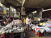 An outdoor open market under the Metro rail line in downtown Medellin, Colombia.