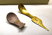 Gold & carved wooden spoons from the pre-Hispanic indigenous Calima Culture in the Calima Gold Museum, Cali, Colombia.