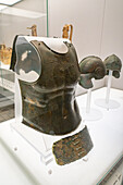 A bronze anatomical breastplate and armored belt in the National Archaeological Museum of Naples, Naples, Italy. Circa 4th Century B.C., from Canosa, Monterisi-Rossignol. Magna Graecia Collection.