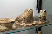 Small statuettes of frogs in the Vesuvian Life Gallery, National Archaeological Museum of Naples, Naples, Italy. The lead-glazed terra cotta figures are from Pompeii, circa 1st Century A.D.