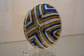 A colored ribbon glass bowl in the Vesuvian Life Gallery, National Archaeological Museum of Naples, Naples, Italy. From 1st Century Pompeii.