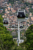 Gondolas of the Medellin Metrocable system serving the lower income neighborhoods in Medellin, Colombia.