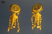 Gold earrings from Taranto in the National Archaeological Museum of Naples, Naples, Italy. Circa 4th Century B.C. Magna Graecia Collection.