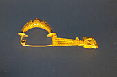 A gold fibula or broach in the National Archaeological Museum of Naples, Naples, Italy. From Ruvo, circa 6th-5th Century B.C. Magna Graecia Collection.
