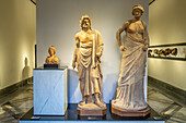 Three 1st Century B.C. terracotta statues from Pompeii in the National Archaeological Museum of Naples, Naples, Italy. Tentatively identified as Bellona - goddess of war, Asclepius - god of medicine, and Venus. From the Temple of Asclepius in Pompeii.