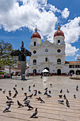 The Main Square of Rionegro, Colombia, with a bronze statue of General José María Córdova Muñoz, and the cathedral.
