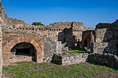 Ruins of a pastry bakery, Building I.14.3, in the ancient Roman ruins of Pompeii, Italy.