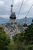 Gondolas of the Medellin Metrocable system serving the lower income neighborhoods in Medellin, Colombia.