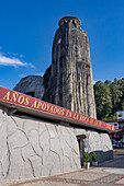 The exterior of the unusual Church of Our Lady of Chiquinquirá in El Peñol in Colombia. The tower imitates the shape of the nearby Piedra del Peñon.