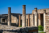 Columns around the atrium of the House of Tryptolemus, Building VII.7.2, in the ancient Roman ruins of Pompeii, Italy.