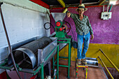 An electric coffe bean depulper on a small coffee plantation in Colombia. This machine crushes the coffee cherries to separate the beans from the pulp.