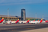 Terminal T4, control tower & Iberian Airlines jetliners at Adolfo Suárez Madrid–Barajas Airport, Madrid, Spain.