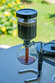 A siphon coffee maker brewing coffee during a tour of a coffee farm in Colombia.