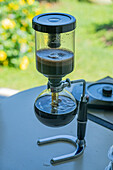 A siphon coffee maker brewing coffee during a tour of a coffee farm in Colombia.