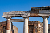 Columns in front the Building of Eumachia on the east side of the Forum in the ancient Roman ruins of Pompeii, Italy.