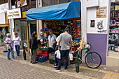 Shoppers at a small food market on the street in Rionegro, Colombia.