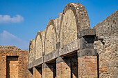 Facade of the Macellum or marketplace, Building VII.9.7, on the Forum in the ancient Roman ruins of Pompeii, Italy.