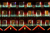 Balconies of the buildings in the Plaza Mayor of Madrid decorated with Christmas lights.