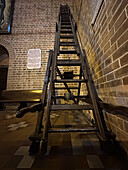A rolling wooden extension ladder in the Cathedral of Medellín, Colombia, capable of reaching the ceiling.