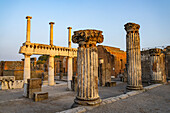 Columns of the Basilica, Building VIII.1.1, looking east toward the Forum in the ancient Roman ruins of Pompeii, Italy.