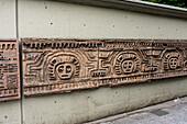 Reproduction of the pattern of a pre-Colombian Quimbaya rodillo as wall art in Medellin, Colombia. A rodillo was a ceramic cylinder used to make patterns on fabric or on skin, like a tattoo.