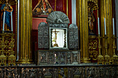 The elaborate silver altar table in front of the main altarpiece in the Cathedral of St. Nicholas in Rionegro, Colombia.