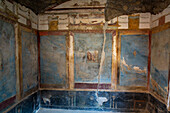 Colorful fresco in the House of Venus in the Shell, Building II.3.3, in the ancient Roman ruins of Pompeii, Italy.