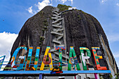 The sign at the Piedra del Penon or Penon de Guatape, a rock formation near Guatape, Colombia.