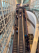 An escalator carrying travelers in Terminal A at Dallas Fort Worth International Airport. Dallas, Texas.